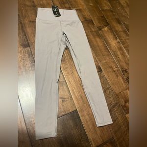Grey leggings, never worn before, tight fitting and small. Soft feel to them!